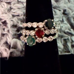 Elegant Sterling Silver trio of emerald, ruby, black onyx and zirconia rings.